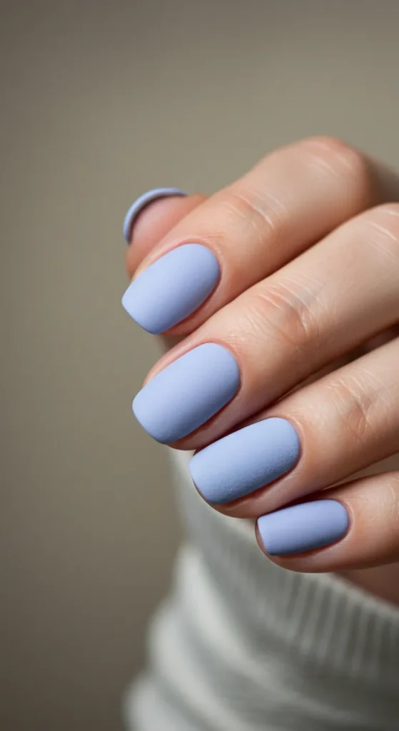 Matte baby blue or lavender nails with a soft, velvety finish, exuding modern elegance and charm.

