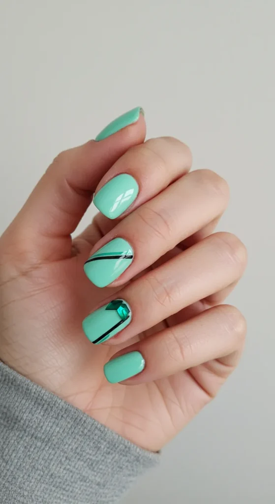 A stylish set of Mint Green nails featuring a bold and refreshing shade, perfect for a trendy and vibrant manicure.