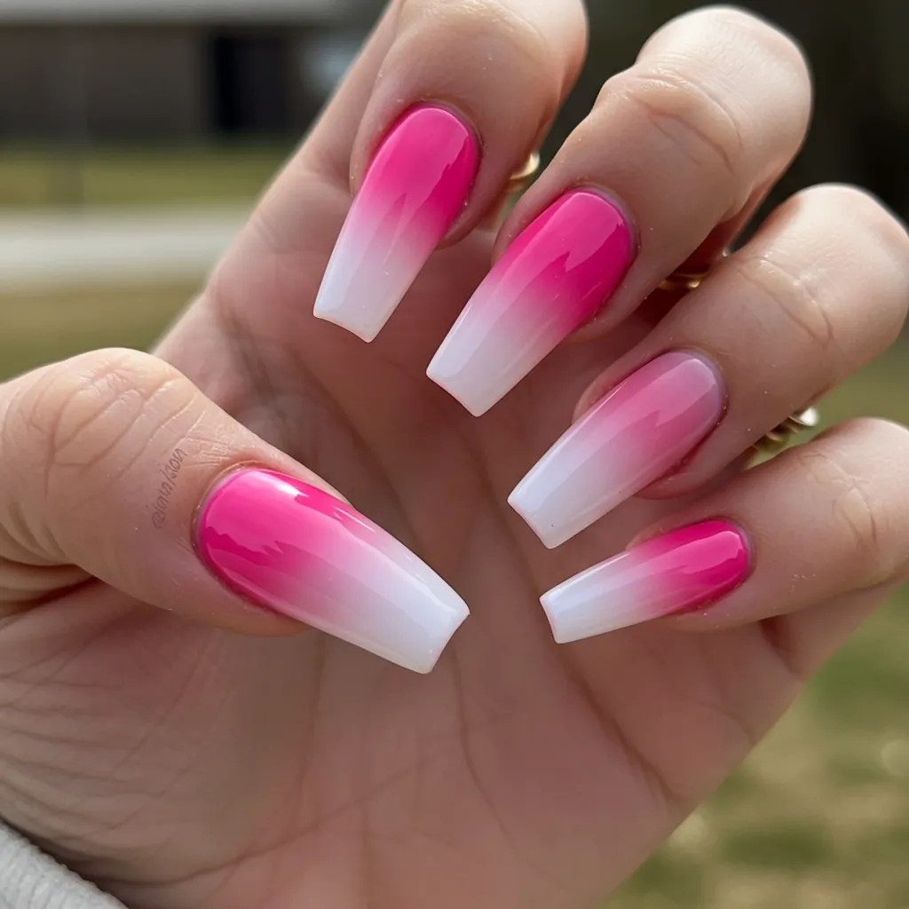 Pink gradient ombre nails transitioning from deep pink at the base to light blush at the tips, creating a soft and romantic look.